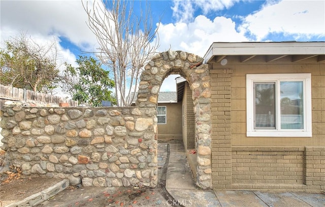 view of property exterior featuring fence