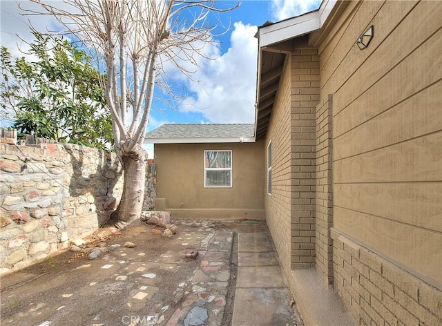 view of side of home with a patio