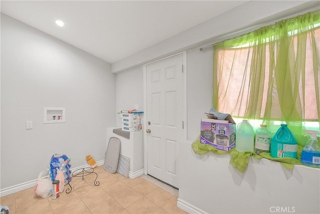 recreation room featuring baseboards, light tile patterned floors, and recessed lighting