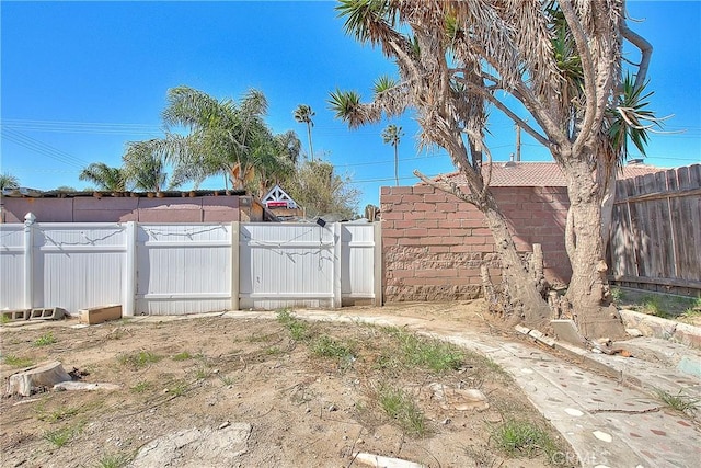 view of yard featuring a gate and fence