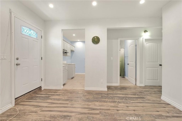 entrance foyer with light wood-style flooring, baseboards, and recessed lighting
