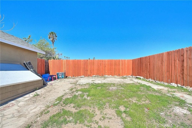 view of yard with a fenced backyard