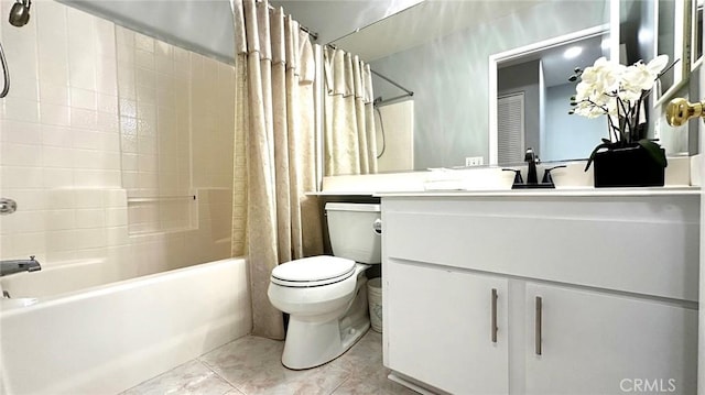 full bathroom with vanity, toilet, tile patterned floors, and shower / bath combo with shower curtain