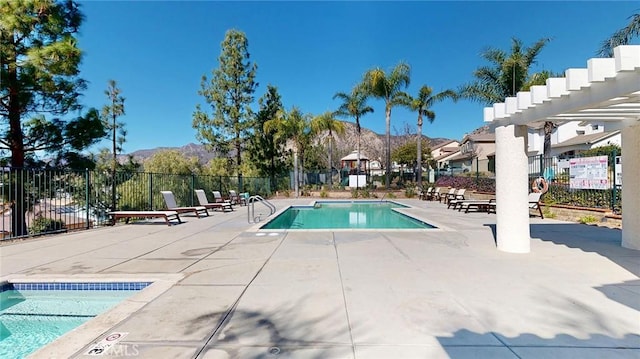 view of pool featuring a mountain view and a patio