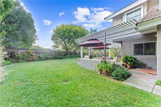 view of yard featuring a patio area, a fenced backyard, and a pergola