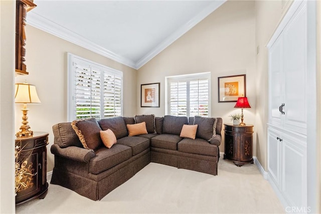 living area featuring a healthy amount of sunlight, ornamental molding, and vaulted ceiling