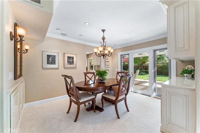 dining space with baseboards, visible vents, ornamental molding, and light colored carpet