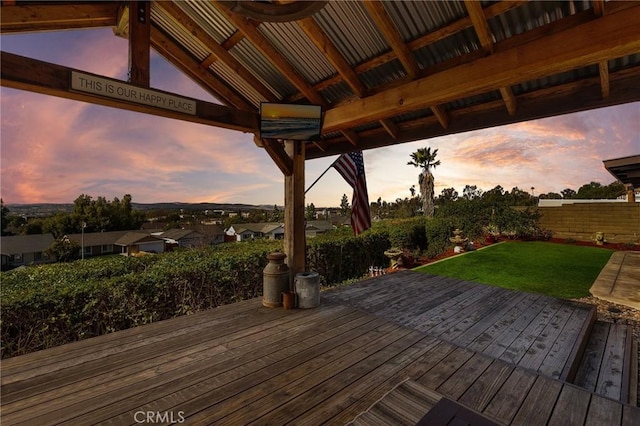 deck at dusk with a yard