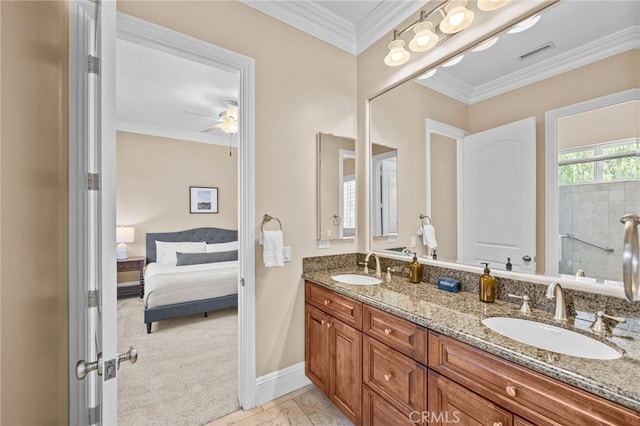 bathroom featuring ceiling fan, ornamental molding, and vanity