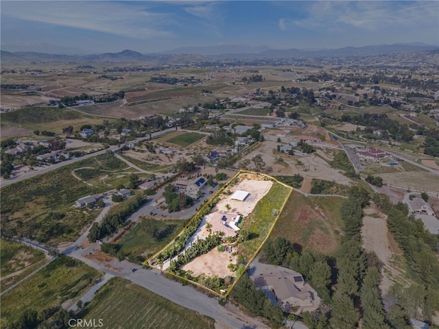 drone / aerial view featuring a mountain view and a rural view