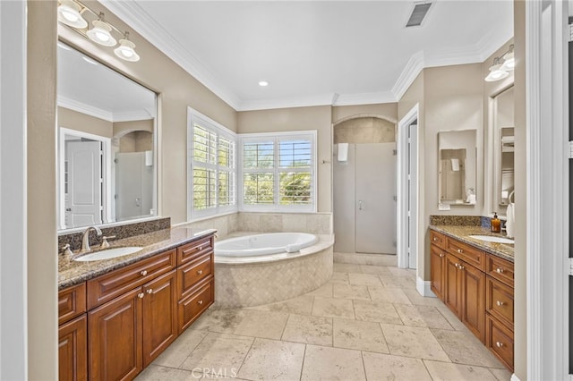 bathroom with ornamental molding, vanity, and independent shower and bath