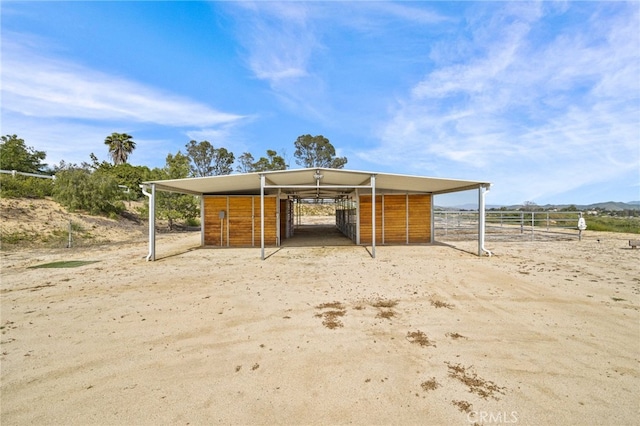 view of outbuilding featuring a rural view