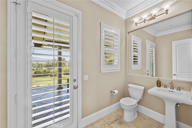 bathroom featuring ornamental molding, sink, and toilet