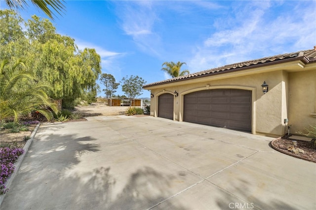 view of side of property featuring a garage