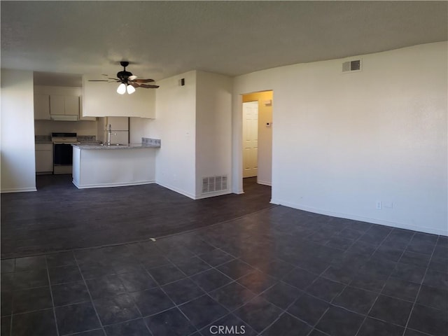 unfurnished living room featuring sink and ceiling fan