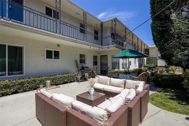 view of patio / terrace featuring an outdoor living space and a balcony