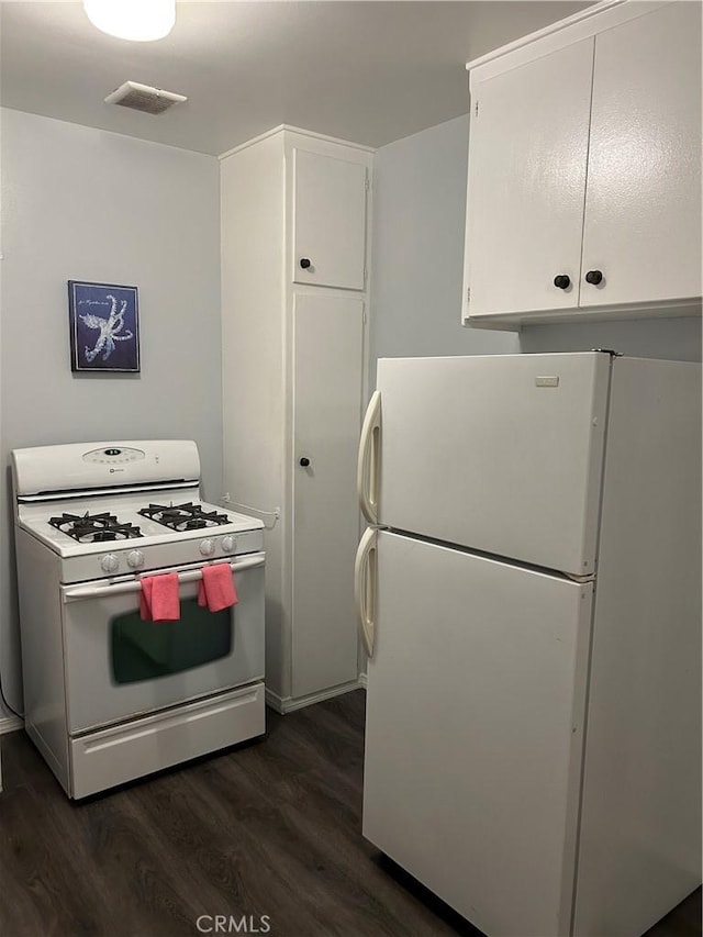 kitchen with white cabinetry, white appliances, and dark wood-type flooring