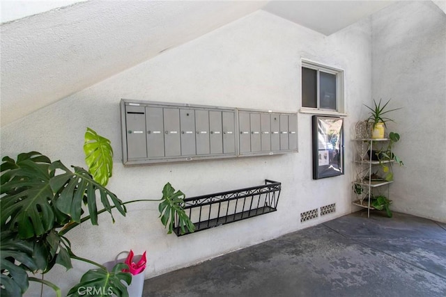 exterior space with mail area and visible vents