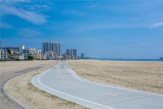 view of road with a city view and a water view