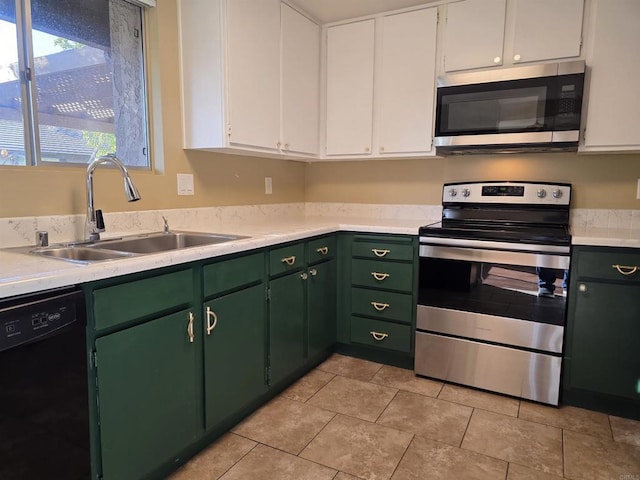 kitchen featuring a sink, white cabinetry, stainless steel appliances, and light countertops