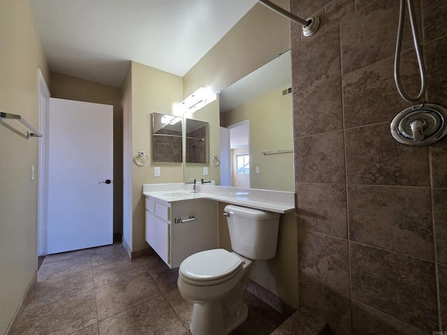 full bathroom featuring baseboards, visible vents, toilet, tile patterned flooring, and vanity