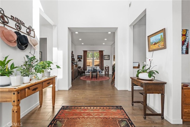 entrance foyer featuring recessed lighting, baseboards, and wood finished floors