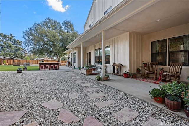 view of yard featuring a patio area and an outdoor bar