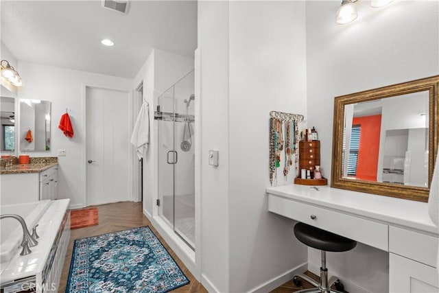 full bathroom featuring vanity, recessed lighting, baseboards, a shower stall, and visible vents