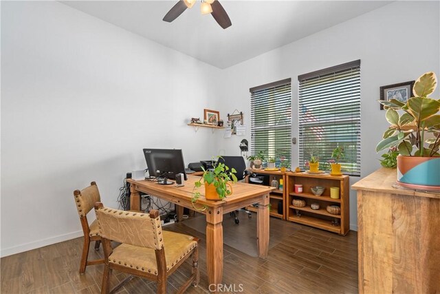 office featuring baseboards, wood finished floors, and a ceiling fan