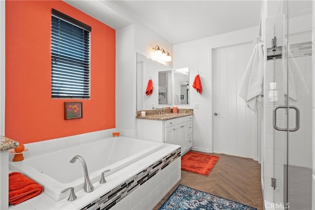 bathroom with separate shower and tub, parquet flooring, and vanity