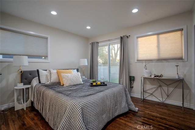 bedroom with dark wood-type flooring