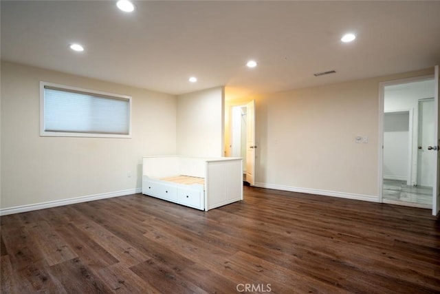 spare room with dark hardwood / wood-style floors