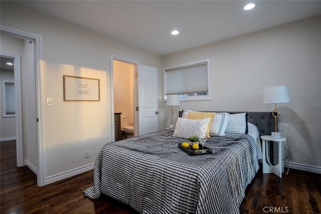 bedroom featuring dark wood-type flooring and connected bathroom