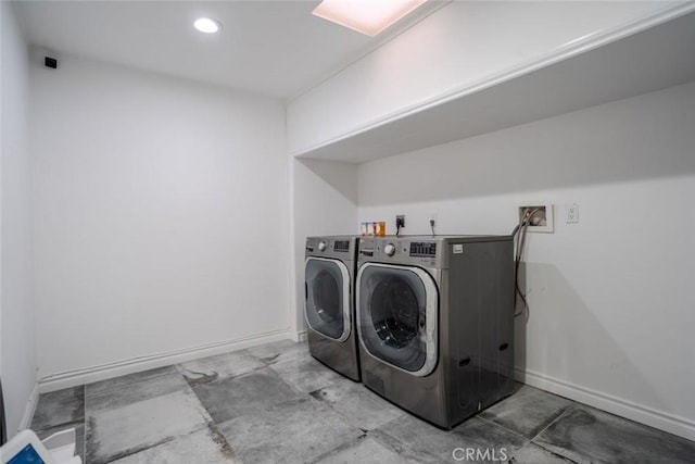 clothes washing area featuring washer and clothes dryer