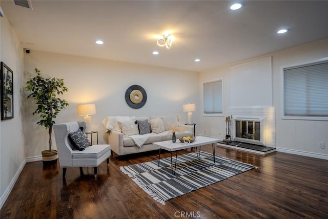 living room with dark hardwood / wood-style floors