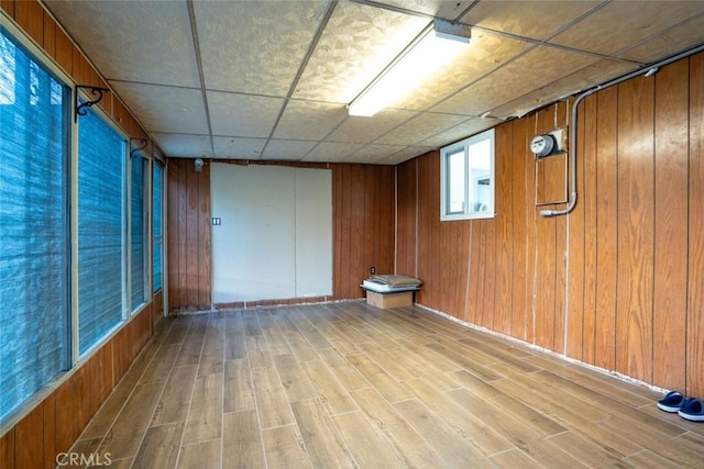 interior space featuring wooden walls and hardwood / wood-style floors