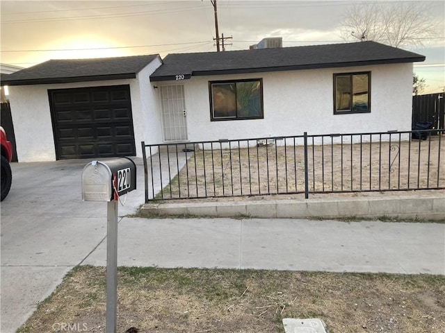 single story home featuring a garage