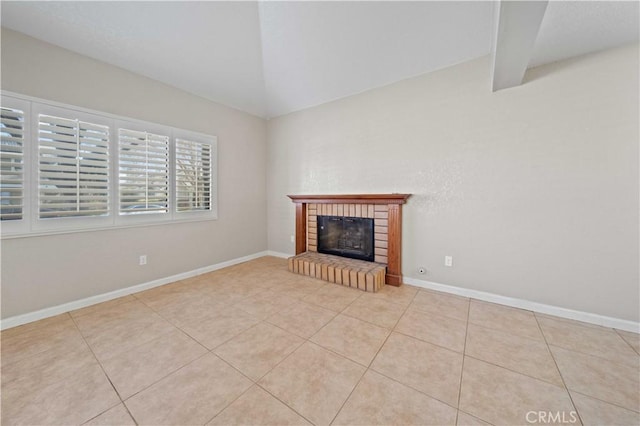 unfurnished living room featuring lofted ceiling, light tile patterned floors, and a brick fireplace