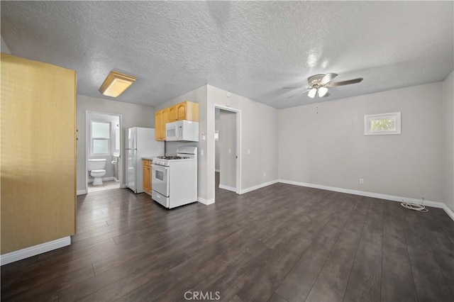 unfurnished living room featuring dark hardwood / wood-style floors, a textured ceiling, and ceiling fan