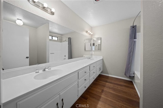 bathroom featuring vanity, a shower with curtain, and wood-type flooring