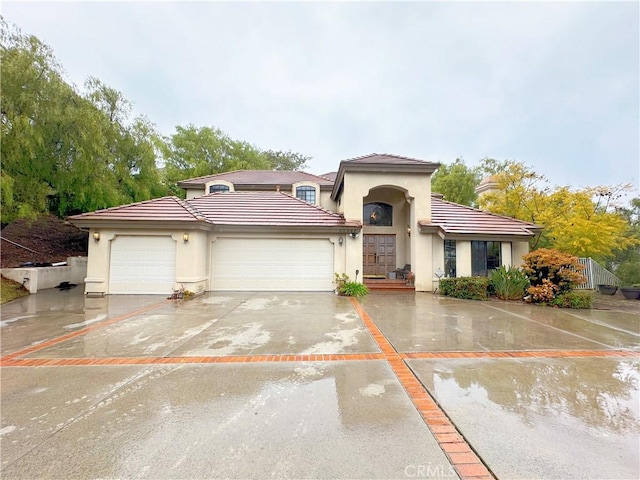 mediterranean / spanish-style house featuring a garage