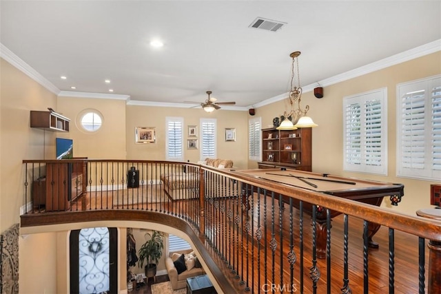 interior space featuring hardwood / wood-style flooring and ornamental molding