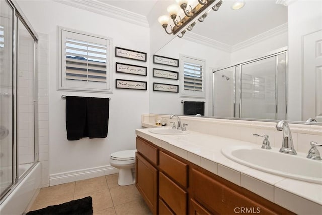 full bathroom featuring enclosed tub / shower combo, vanity, toilet, crown molding, and tile patterned floors