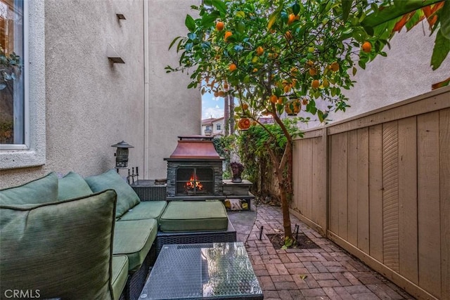 view of patio / terrace with exterior fireplace