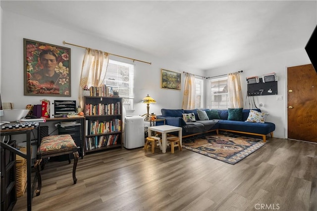 living room with hardwood / wood-style flooring and a wealth of natural light