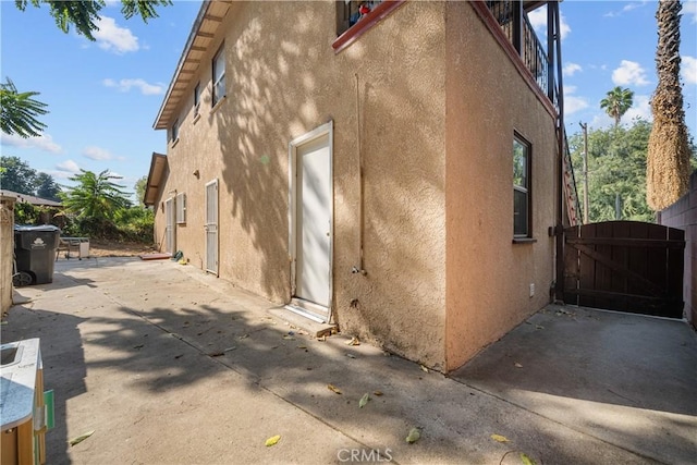 view of property exterior featuring a patio