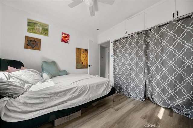 bedroom featuring ceiling fan and light wood-type flooring