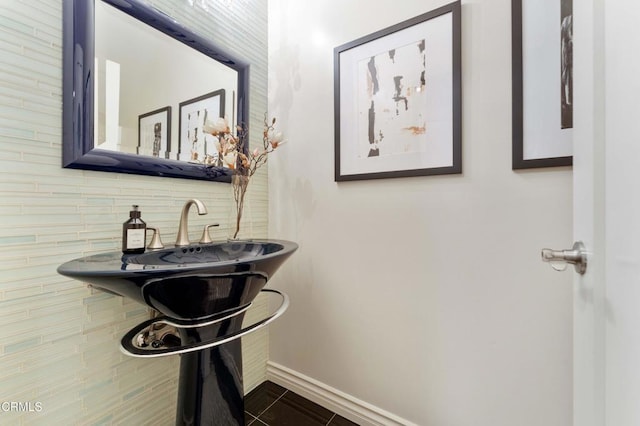 bathroom featuring tile patterned flooring and decorative backsplash