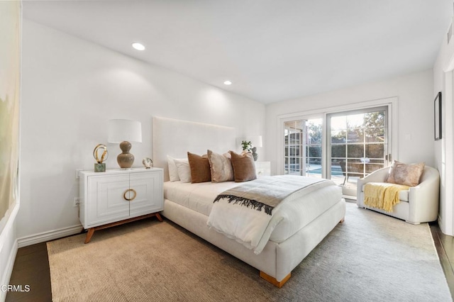 bedroom featuring hardwood / wood-style floors and access to outside