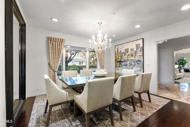 dining area with ornamental molding, dark hardwood / wood-style floors, and a chandelier